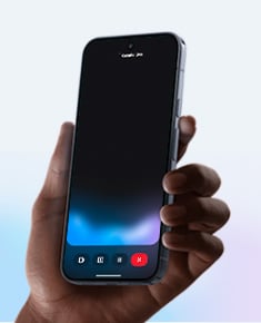 A human hand holds a smartphone in portrait orientation
