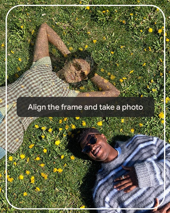 The image shows two people lying on a lawn, highlighting how Pixel's 'Add Me' camera feature ensures everyone is in the photo