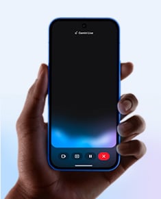 A human hand holds a smartphone in portrait orientation and the screen shows Gemini Live
