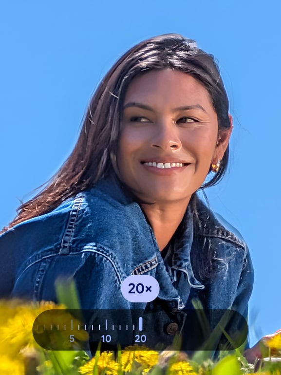 Woman lying in a field and the photo is 20x zoomed in to show a close-up of her 