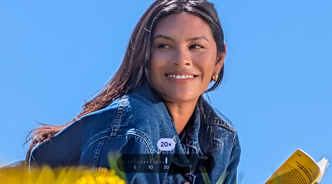 Woman lying in a field and the photo is 20x zoomed in to show a close-up of her 